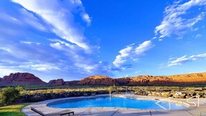 A swimming pool with a view of mountains and a clear sky. - *New Owner Special* - Modern Luxury Casita (Ivins)