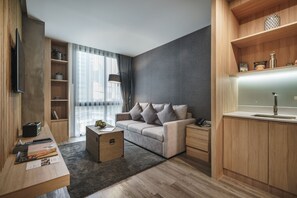 Junior Suite | Living area | 55-inch LCD TV with satellite channels, TV