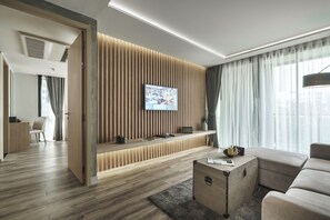 One-Bedroom Suite | Living area | 55-inch LCD TV with satellite channels, TV - Tastoria Collection Hotel Sukhumvit (Bangkok)