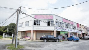 A hotel with a sign reading "Jerteh Hotel" and a visible storefront with a "SK Mart" sign. - Jerteh Hotel, Terengganu (Jerteh)