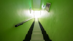 A staircase with alternating black and white steps leading up to a light source at the top. - Golden Pearl Hotel Near Universiti Tun Hussein Onn Malaysia UTHM (Batu Pahat)