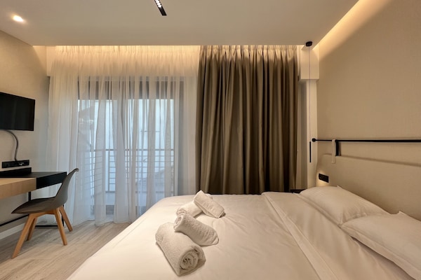 In-room safe, desk, laptop workspace, blackout curtains