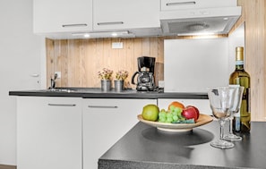 Fridge, stovetop, coffee/tea maker, cookware/dishes/utensils