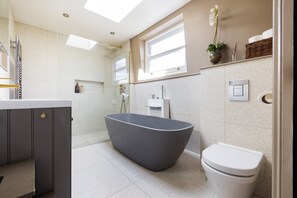 Bathtub, hair dryer, towels, soap