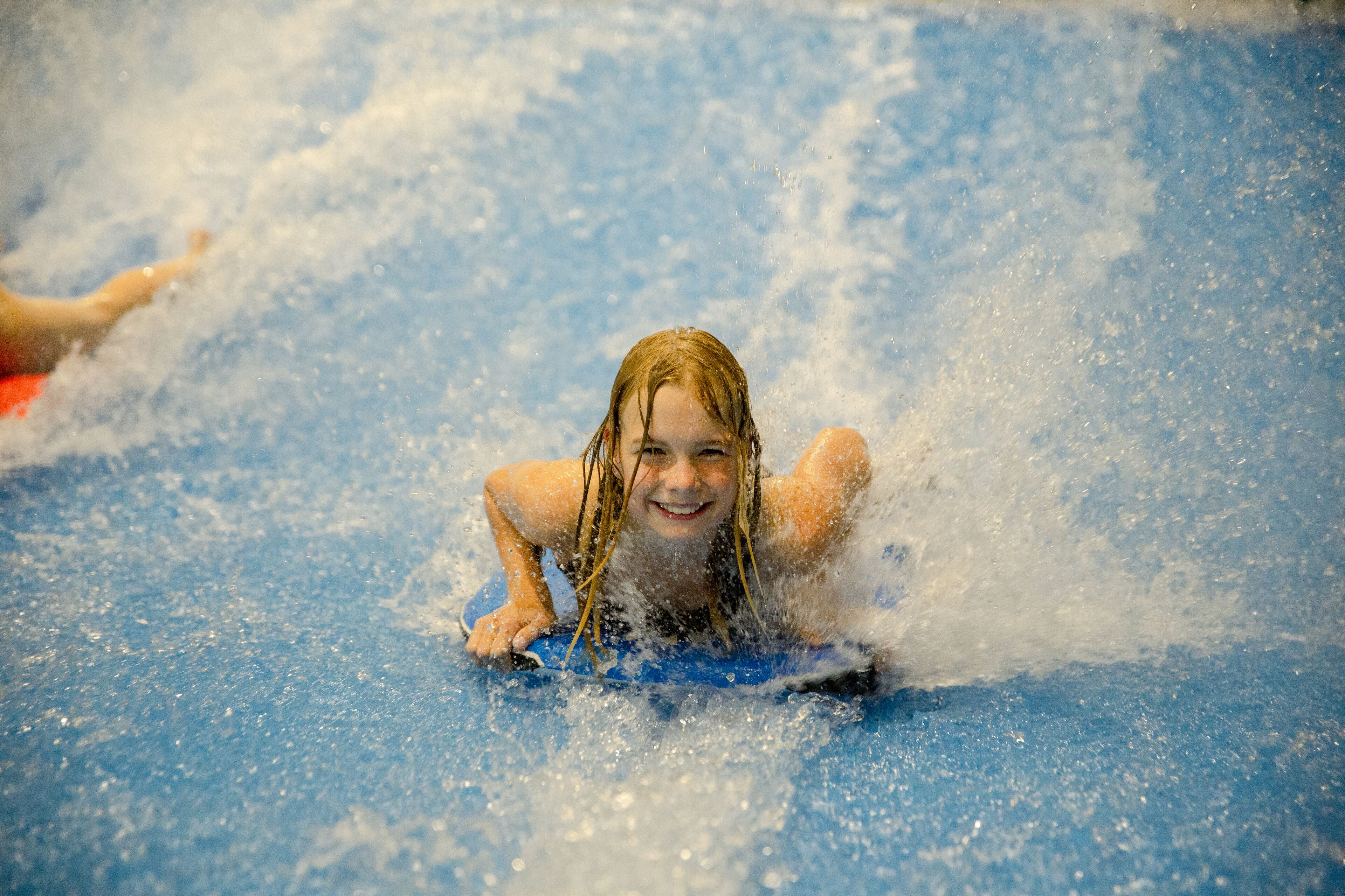 A child on a water slide.