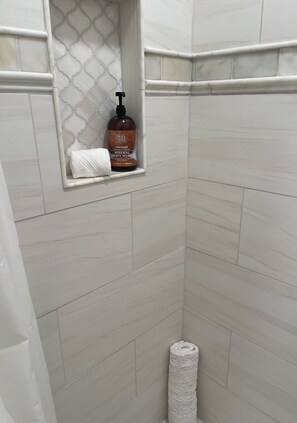 Combined shower/tub, hair dryer, towels, soap