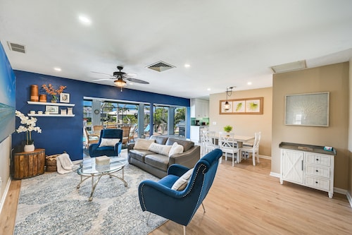 Charming and cozy with a dock for your boat and minutes to the Beach