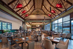 A spacious dining area with high ceilings, large windows, and modern lighting fixtures. - Wyndham Fengqing Resort (Lincang)