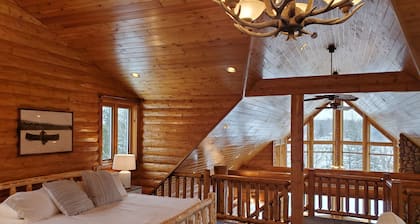Lakefront secluded mult-family retreat with game room and two cabins.