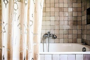 Bathtub, hair dryer, towels, soap