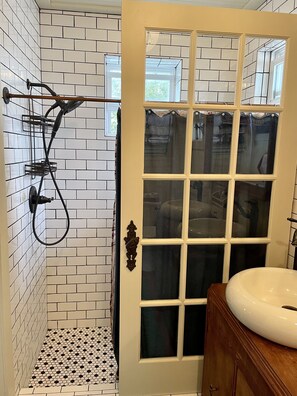 Combined shower/tub, hair dryer, towels, soap