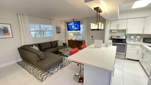 A modern apartment with a living area, kitchen, and dining space. - Walk to Fort Lauderdale Beach - Perfect Beach Escape (Fort Lauderdale)