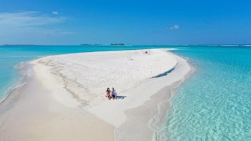 Beach nearby, white sand, free beach shuttle, snorkeling