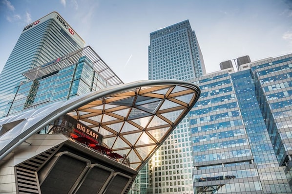 A modern building with a glass facade and a prominent 'BIG EASY' sign. - Livestay 3 Bed Apt on 8th Floor With Amazing Views (London)