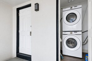 Our washer and dryer are placed in its own storage area to lessen the clutter.