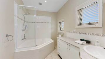 Shower, hair dryer, towels, shampoo