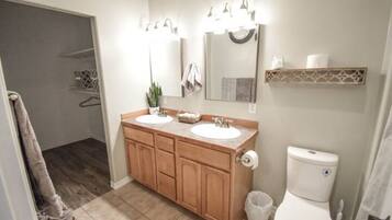 Bathtub, hair dryer, towels, soap