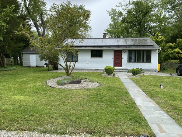 A single-story house with a front yard, a small tree, and a pathway leading to the front door. - Cute, cozy rancher close to down town Annapolis (Annapolis)