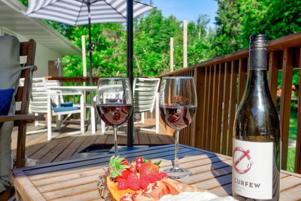 Enjoy drinking wine and having a charcuterie tray in our back yard.