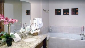 Bathtub, jetted tub, hair dryer, towels