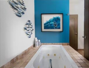 Bathtub, hair dryer, bidet, towels