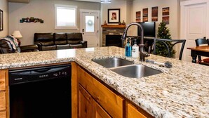 A kitchen with granite countertops, a dishwasher, and a sink. - Montague Manor" W&D, Hot Tub, Queen Beds, Sleeps6 (Bluffdale)