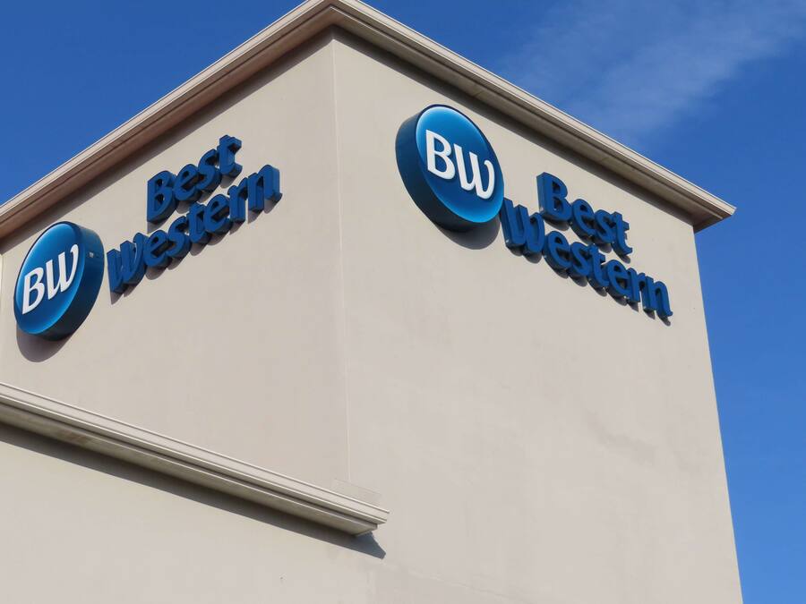 A building with signage reading "Best Western" and "BW" indicating the hotel chain.