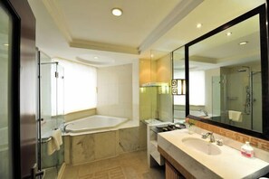 A modern bathroom with a glass-enclosed shower, a freestanding bathtub, and a vanity with a large mirror. - Beijing Post & Telecom Conference Centre (Beijing)