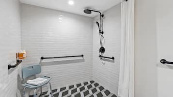 Shower, designer toiletries, hair dryer, towels