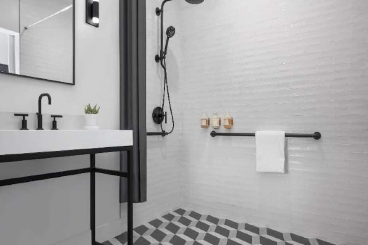 Shower, designer toiletries, hair dryer, towels