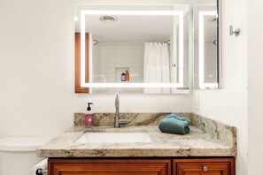 Combined shower/bathtub, hair dryer, towels, soap
