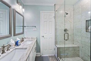 Shower, hair dryer, towels, shampoo