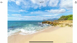 A beach with clear skies and calm waters.