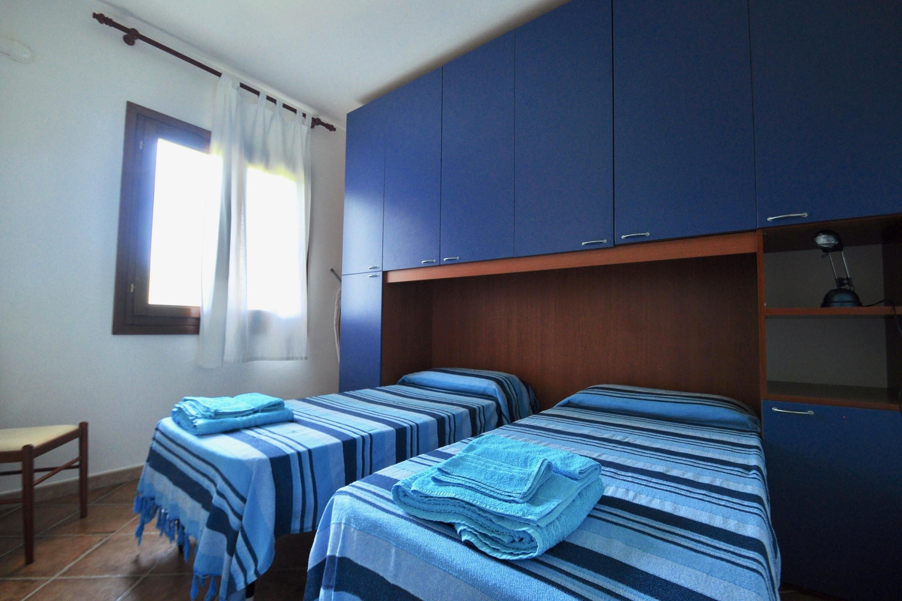 Apartamento família, 2 quartos, 2 banheiros (Le Dimore di Nettuno 4 With Pool) | 2 quartos, espaço de trabalho para notebook