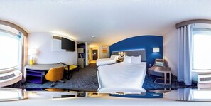 A hotel room with a bed, a desk, a chair, a TV, and a bathroom. - Comfort Inn & Suites Ofallon - St Louis Area (O'Fallon)
