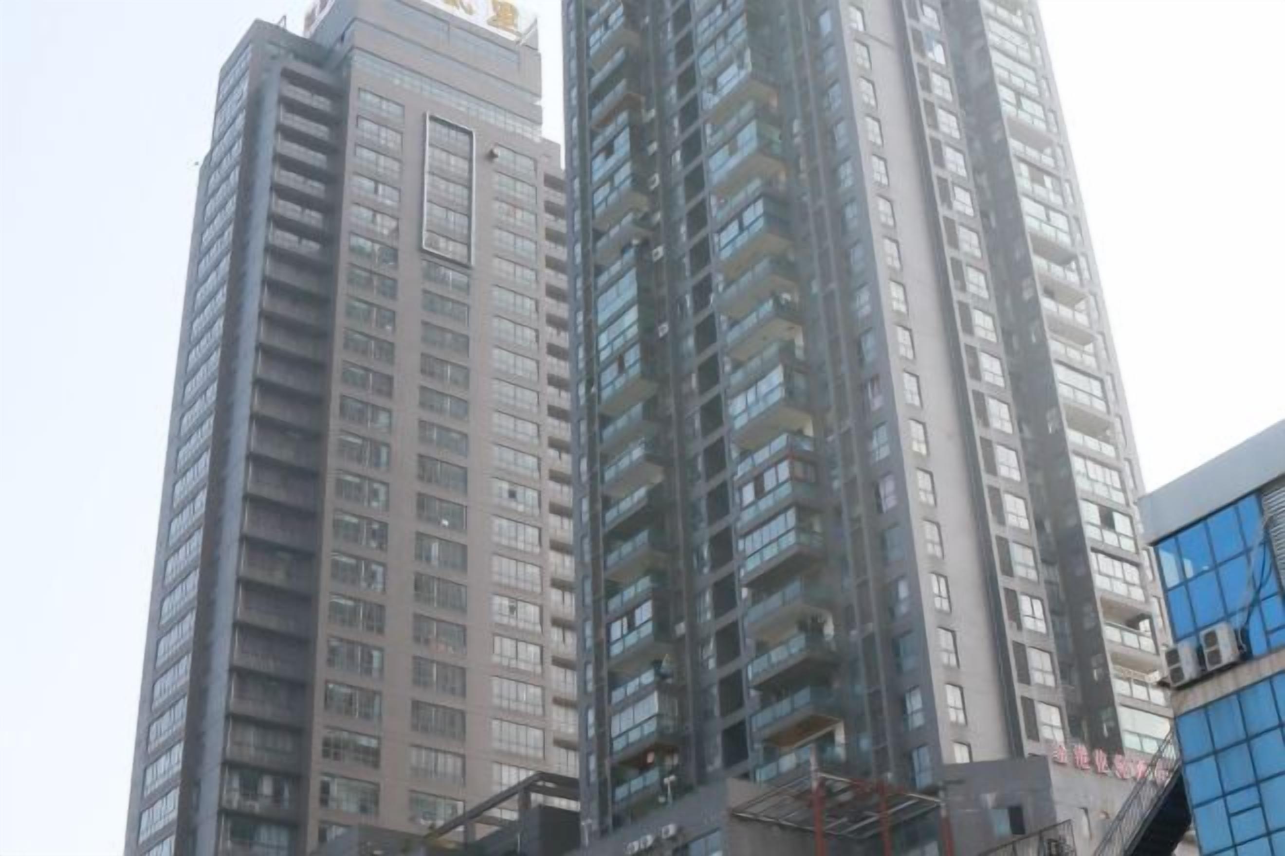 A high-rise building with multiple floors and balconies.