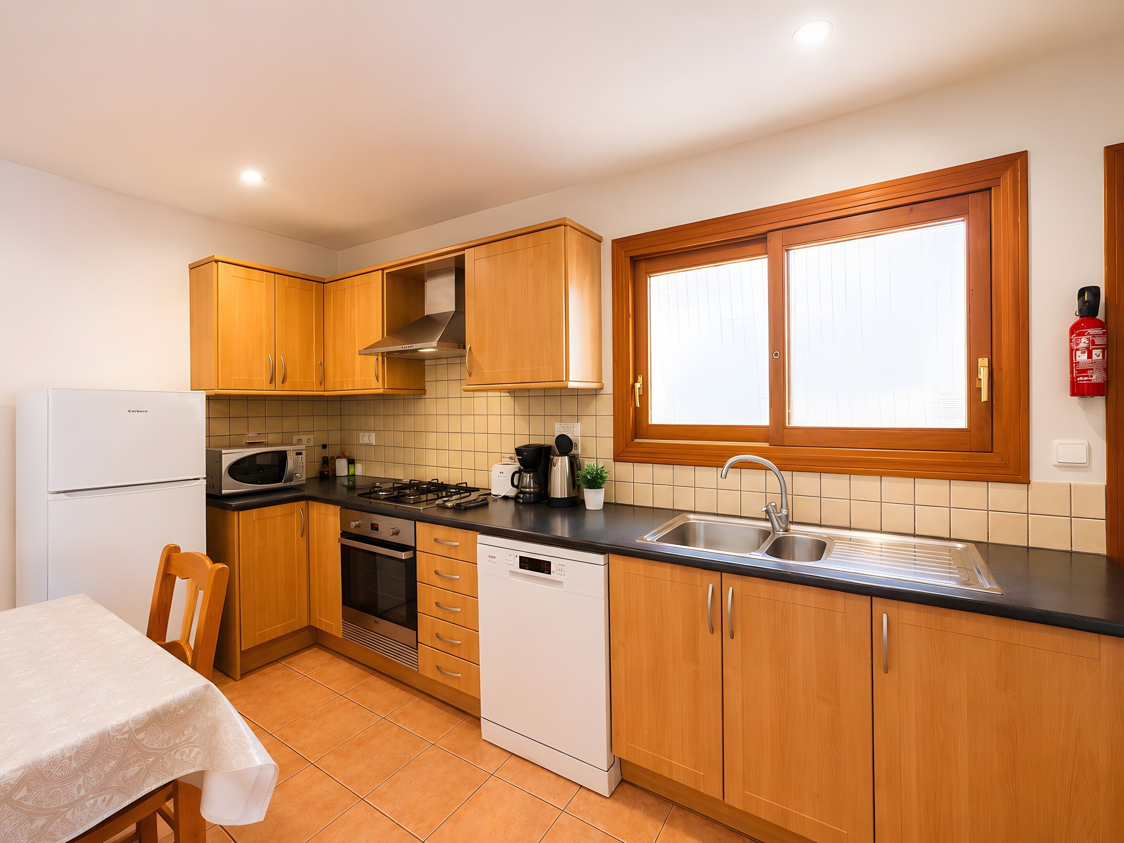 Coffee/tea maker, fridge, microwave, oven