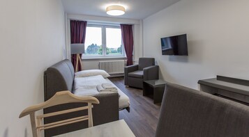 Family Apartment | Living area | 60-cm flat-screen TV with cable channels, TV