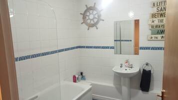 Combined shower/bathtub, deep-soaking bathtub, towels