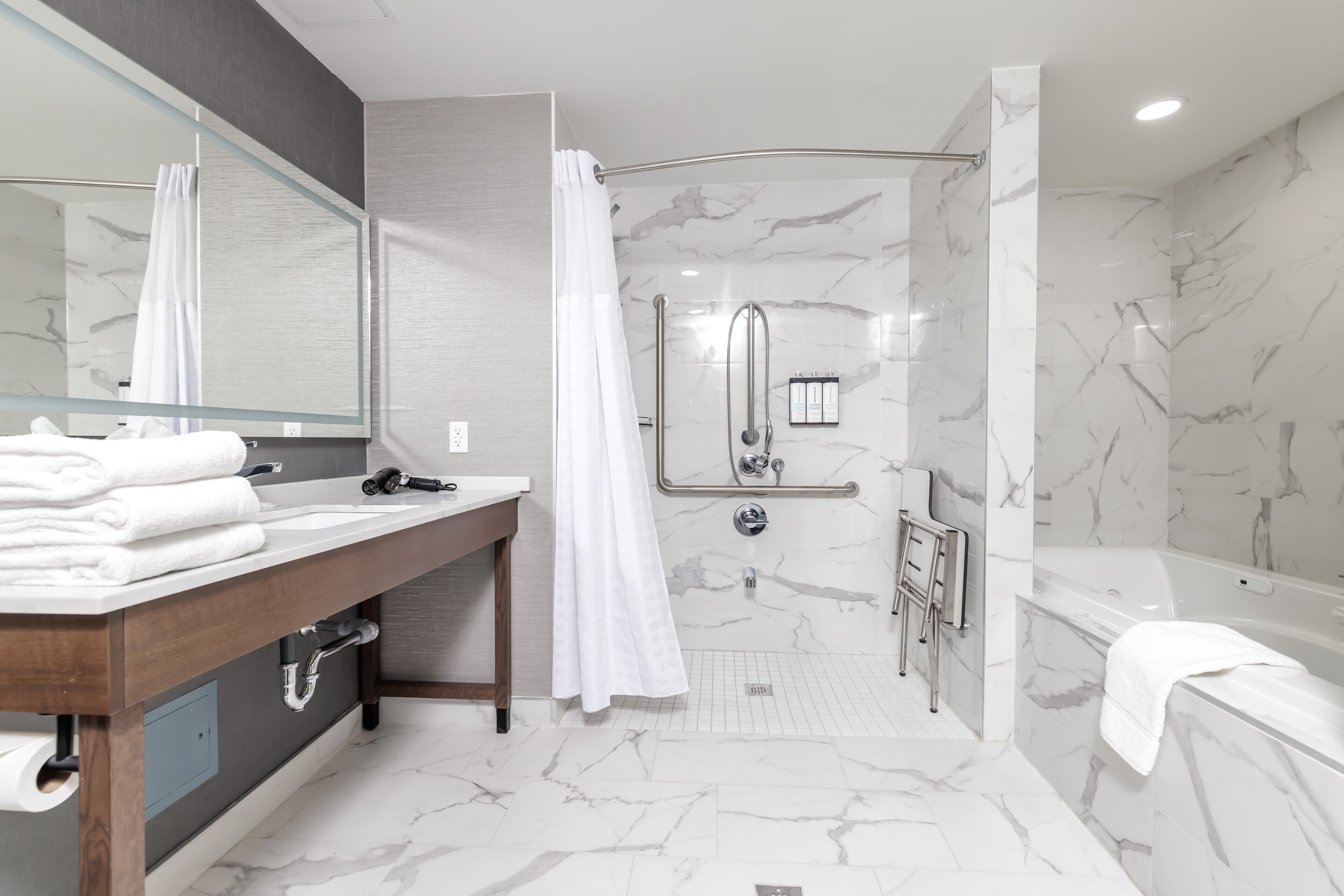 suite, 1 king bed with sofa bed, accessible (roll-in shower) | bathroom | shower, free toiletries, hair dryer, towels