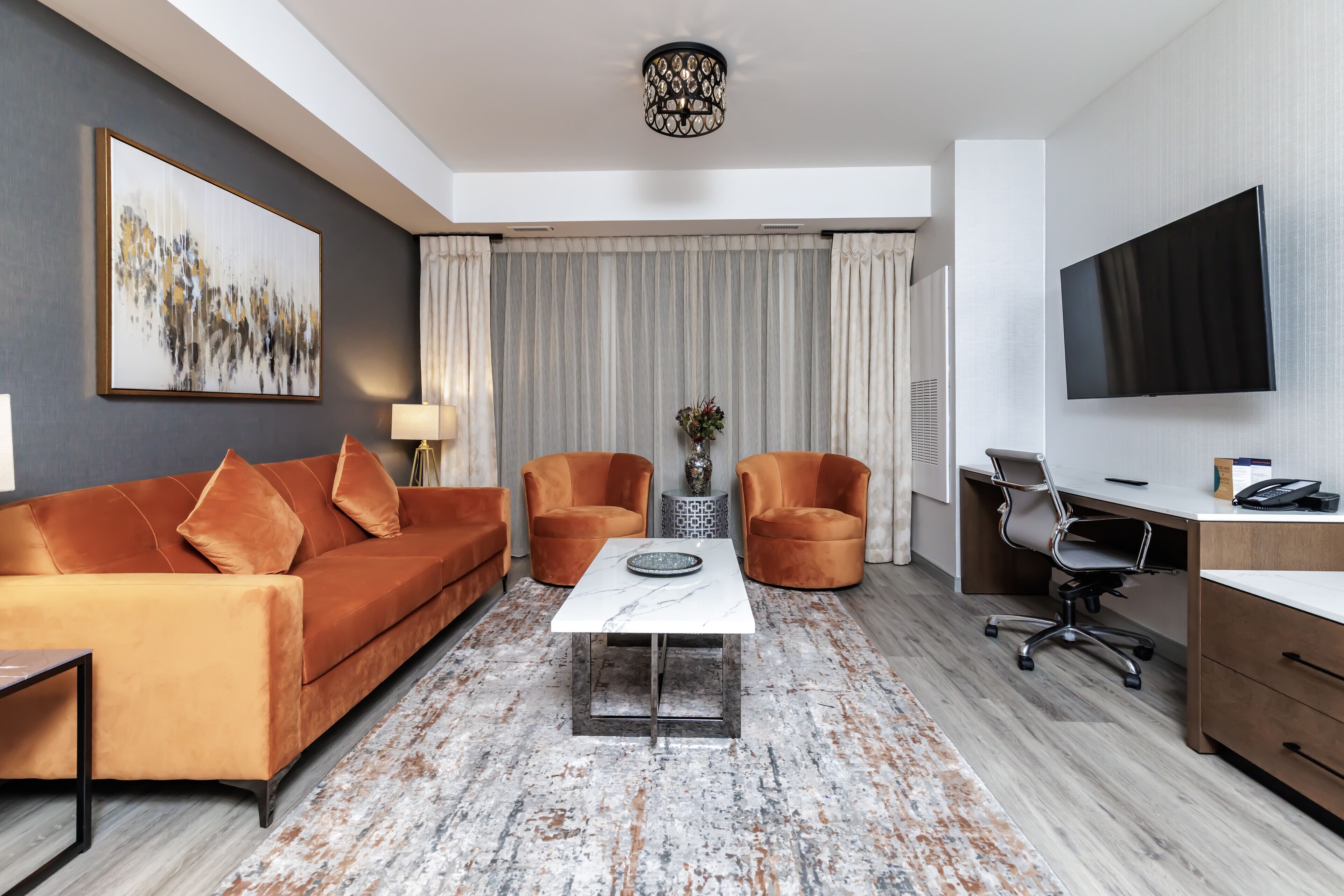 room, 1 king bed with sofa bed (suite) | living area | 55-inch flat-screen tv with cable channels, tv