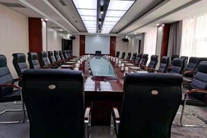 A conference room with a long table and multiple chairs. - Anhua Hotel (Wei County)