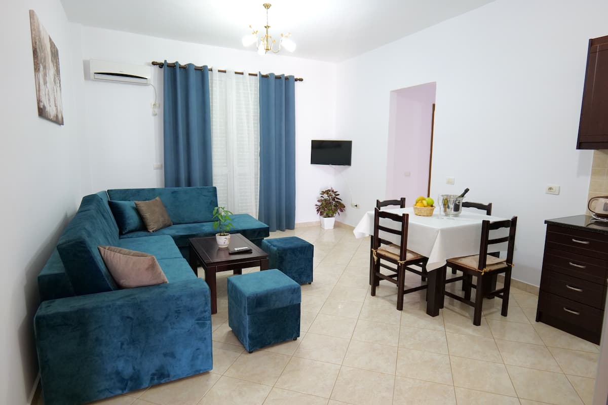 Apartment, 1 Bedroom, Balcony | Living area | Flat-screen TV