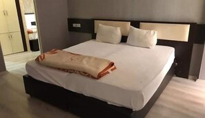 Premium bedding, free minibar items, in-room safe