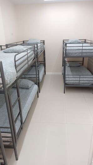 Shared Dormitory | Premium bedding, memory-foam beds, blackout curtains, free WiFi