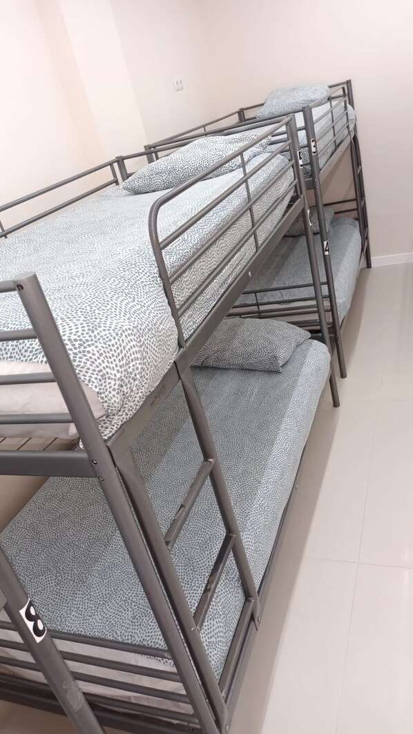 Shared Dormitory | Premium bedding, memory-foam beds, blackout curtains, free WiFi