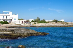 Guests can enjoy stunning ocean views from balconies overlooking the rocky shoreline.