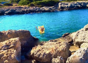 Guests can swim in the ocean from a natural rocky shoreline.