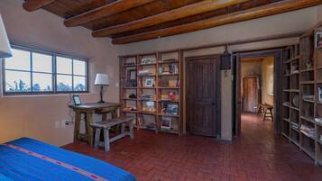 1 bedroom, desk, iron/ironing board, travel crib