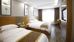 A hotel room with two beds, a desk, a chair, and a window with curtains. - Jinhu Hotel (Wuxi)